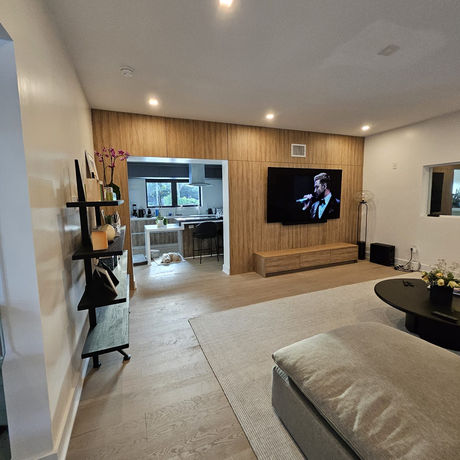 Family room with a completed wood television wall