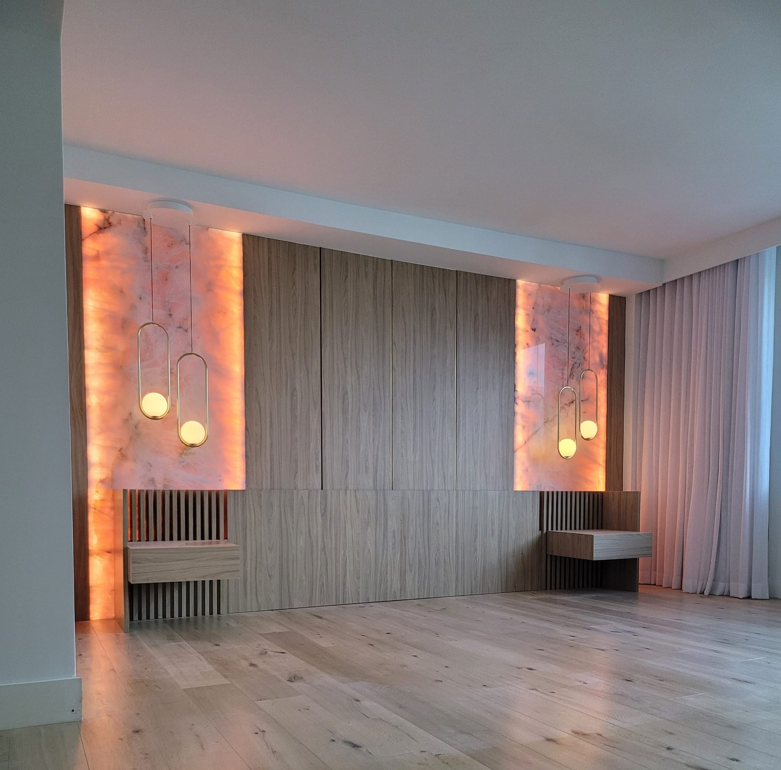 Completed feature wall with wood panels and illuminated stone