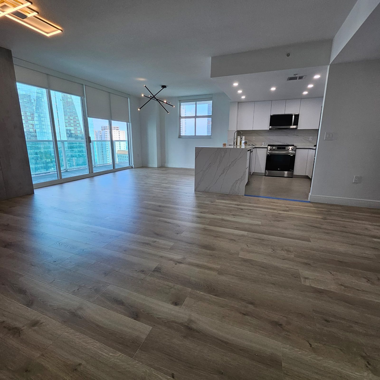 Wide view of the completed open kitchen and living area